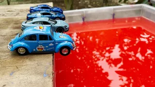 Full Blue Diecast Cars Model Into The Red Water