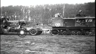 US troops set up 155mm Gun (Long Tom) and  M4 High Speed Tractor tows another one...HD Stock Footage