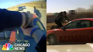 Wild Video Shows Police Clings Onto Hood of Suspect's Car, Tossed to the Ground in Iowa Car Chase