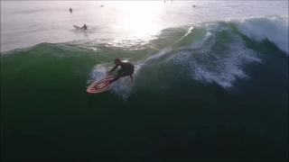 Ventura Surfers taking a long wave in