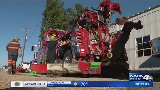 Woman survives multi-vehicle crash with semi