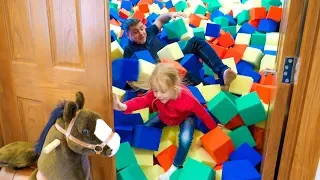 Stacy and dad pretend play at the funny house