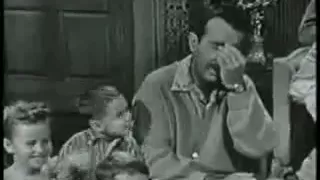 Ernie Ford - singing with a little boy by his side.  Pretty funny.