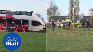 Train derailed in Holland after colliding with a milk truck - Daily Mail