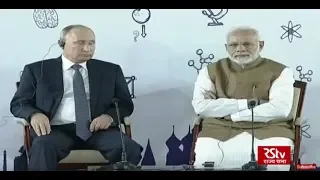 PM Modi and Russian President Vladimir Putin interact with a group of children