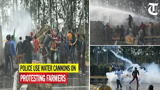 Haryana Police use water cannons and tear gas on the protesting farmers at Jharmari near Ambala