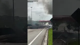 Charred highway after plane crashed, killing 10 in Malaysia