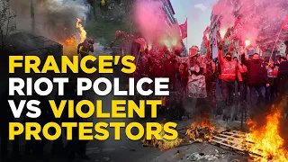 France Protests Live | Protestors Storms Paris' BlackRock Building Holding Flares And Smoke Bombs
