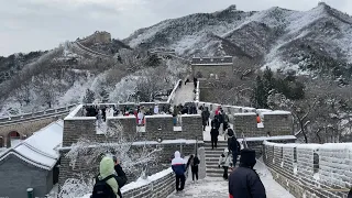 Tourists brave Beijing's icy winds to visit snow-covered Great Wall | AFP