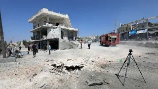 Syrians put out fires after Russian airstrikes near Idlib