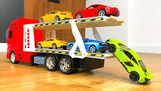 Big die cast model cars being carried by transportation vehicles #2