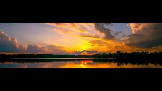 Super wide 32:9 storm clouds at sunset time-lapse. 8K HDR. AV1.