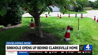 Sinkhole opens behind Clarksville home