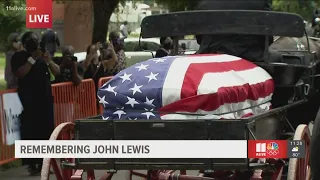 John Lewis' casket leaves church on the way to final Edmund Pettus bridge passing