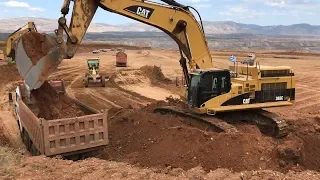 Caterpillar 365C Excavator Loading Mercedes And MAN Trucks With 3 Scoops