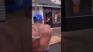 man kicks womans food