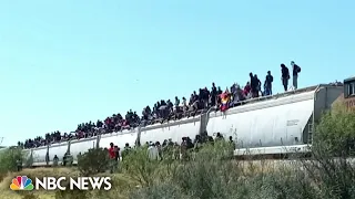 Mexico freight trains halts service after hundreds of migrants hitch rides to border