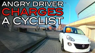 An Angry Motorist Charges A Cyclist