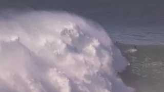 Surfer Surfing Giant Nazare Swell || WooGlobe