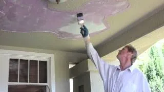 Remove and fix loose stucco from my porch ceiling.