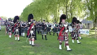 Massed Bands salute Chairman for finale of the 2019 Oldmeldrum Highland Games in Scotland