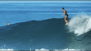 Women Longboard Surfing in Hawaii