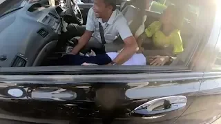 Hero biker saves girl having seizure during traffic jam in Thailand