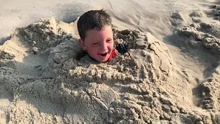 Boo buried in sand