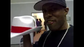 DJ Whoo Kid showing the infamous P.I.M.P. hat on Kyte TV (2008) | Thisis50.com
