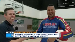 TMJ4's  Shaun Gallagher lands backward half-court shot