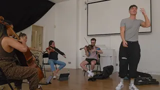 Ren rehearsing with strings for Money Game 3