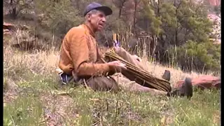 April, 2000. Fred Beckey coiling a Rope in Zion.