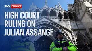 Julian Assange supporters arrive at the London High Court for his appeal ruling