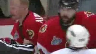 Daniel Alfredsson shoots the puck on Niedermayer