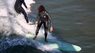 Surf School Owner Aggressively Pulls Female Surfer's Leash