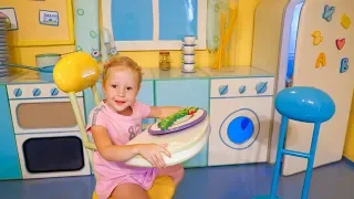 Nastya plays at the funny playhouse of Peppa toy Theme Park