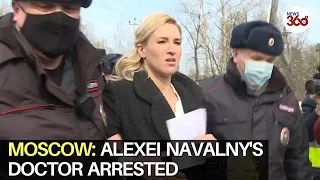 Alexei Navalny's doctor arrested in protest outside penal colony as fears grow for his health