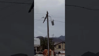 Power pole burning and breaking off