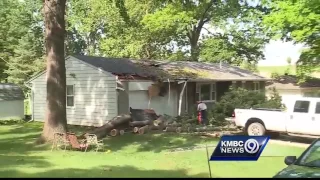 Residents clean up downed trees before next round of storms