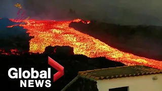 La Palma volcano: Lava "tsunami" gushes down hillside after overflowing main cone