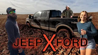 Jeep recovers 2 fords stuck in mud