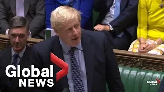 Boris Johnson reacts after U.K. Parliament votes to delay Brexit deal approval