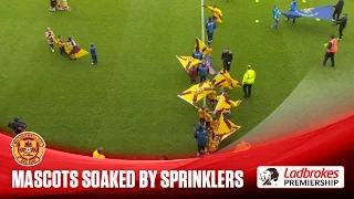 Mascots soaked by faulty sprinkler!