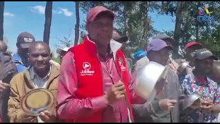 Jeremiah Kioni bangs sufurias with spoons in protest of the high cost of living