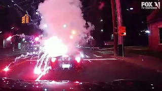 VIDEO: Lit firework tossed into convertible by passing vehicle on July 4