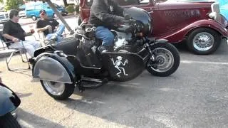 Cool motorcycle with a side car, with the best co-pilot.