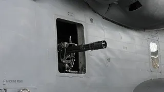 A Gatling gun on the side of a Sikorsky MH 53