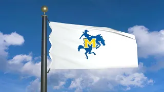 Flag of McNeese State Cowboys waving in the wind (moving clouds)