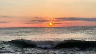 "Morning Majesty: Dawn Breaks Over Mirlo Beach"