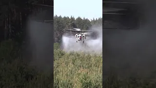 Kamov helicopter spraying water on forest